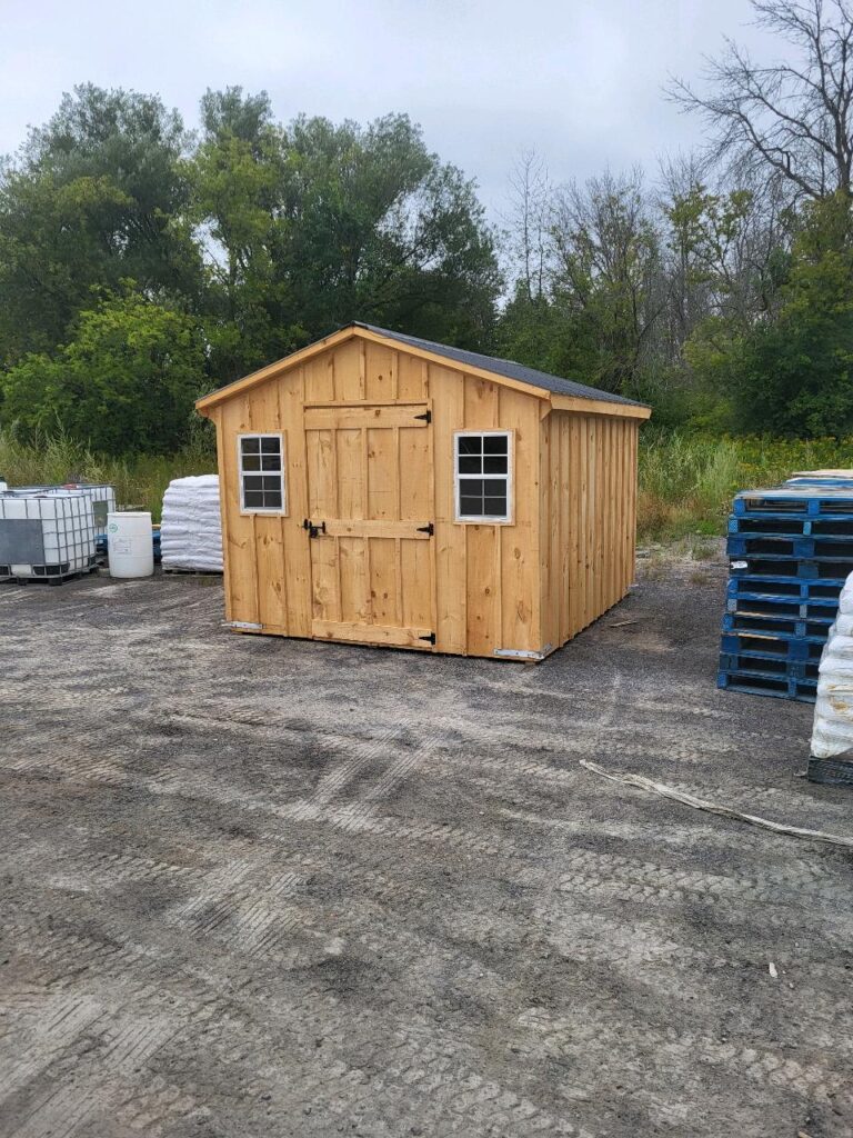 10ft x 12ft wood siding garden shed with a door in the middle and a small window on either side of the door