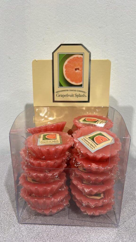 Box of pink coloured scalloped circle shaped Grapefruit scented wax melts