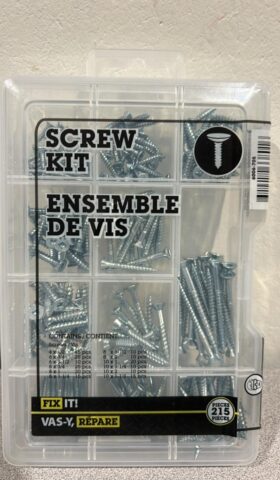 assorted size screws in a clear container with compartments for each size.