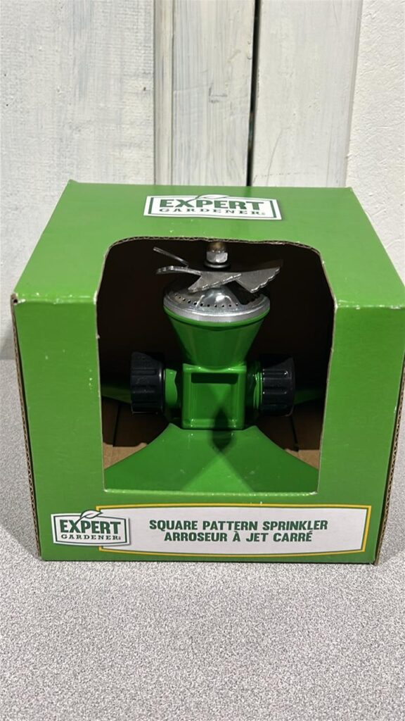 New in box Square pattern Sprinkler head. It has a green base in a green box